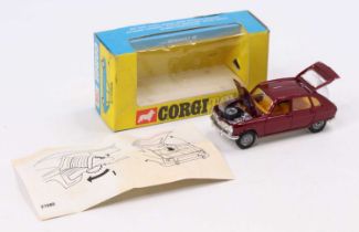Corgi Toys No. 260 Renault 16 comprising of maroon body with yellow interior and cast hubs, comes