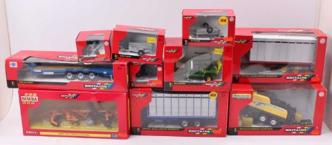 A collection of nine various boxed Britains 1/32 scale farming implements and attachments, all