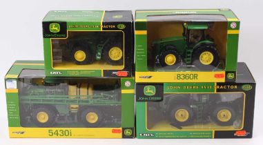 A collection of four various boxed Britains 1/32 scale John Deere farming implements and tractor