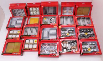A collection of 20 various boxed Britains 1/32 scale farming accessories to include pigs, hay bales,