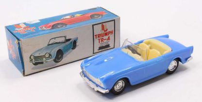 C H Toys Hong Kong plastic friction drive Triumph TR4 Sports Car with its original card box