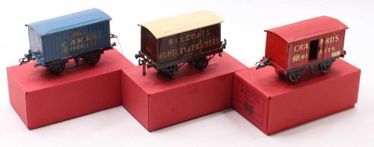 Three Hornby 0-gauge goods wagons, either totally or partially repainted: Carr’s Biscuits;