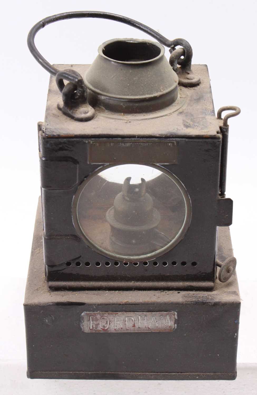 A Welch patent four aspect Eastern Region railway hand lamp with manufacturer's plaque and station