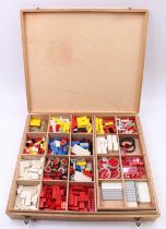 An original 1970s Lego wooden divided case containing a quantity of mixed components and instruction