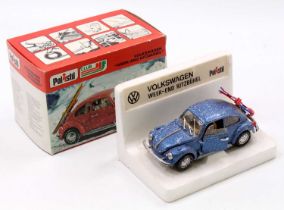 A Polistil 1/25th scale S77 Volkswagen Beetle Ski Edition, metallic blue body, with 'snow', and a