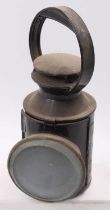 A London Transport interest railwayman's hand lamp marked LT to one side, would benefit from