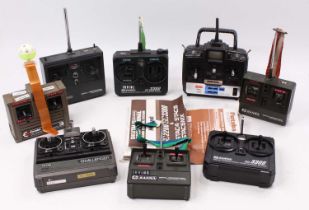 One tray containing a quantity of mixed radio-controlled handsets and control systems to include