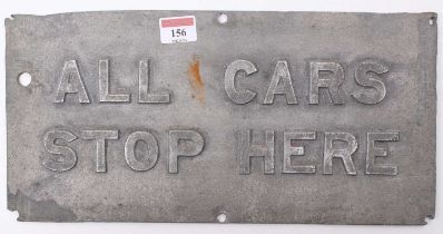 A cast aluminium rectangular tram stop sign, ex-Glasgow, reads "All Cars Stop Here", complete with