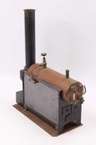 A Stuart Turner No. 501 Babcock boiler with as expected fittings, raised on wooden base with fixed