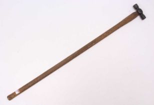 A railway interest long hammer, cast iron ended, length 92cm