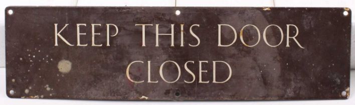 An enamel railway interest advisory notice sign "Keep this door closed", 38x10cm, complete with