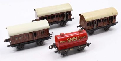 Four items of Bing rolling stock: three 4-wheeled LNER ‘teak’ coaches with cream roofs one each