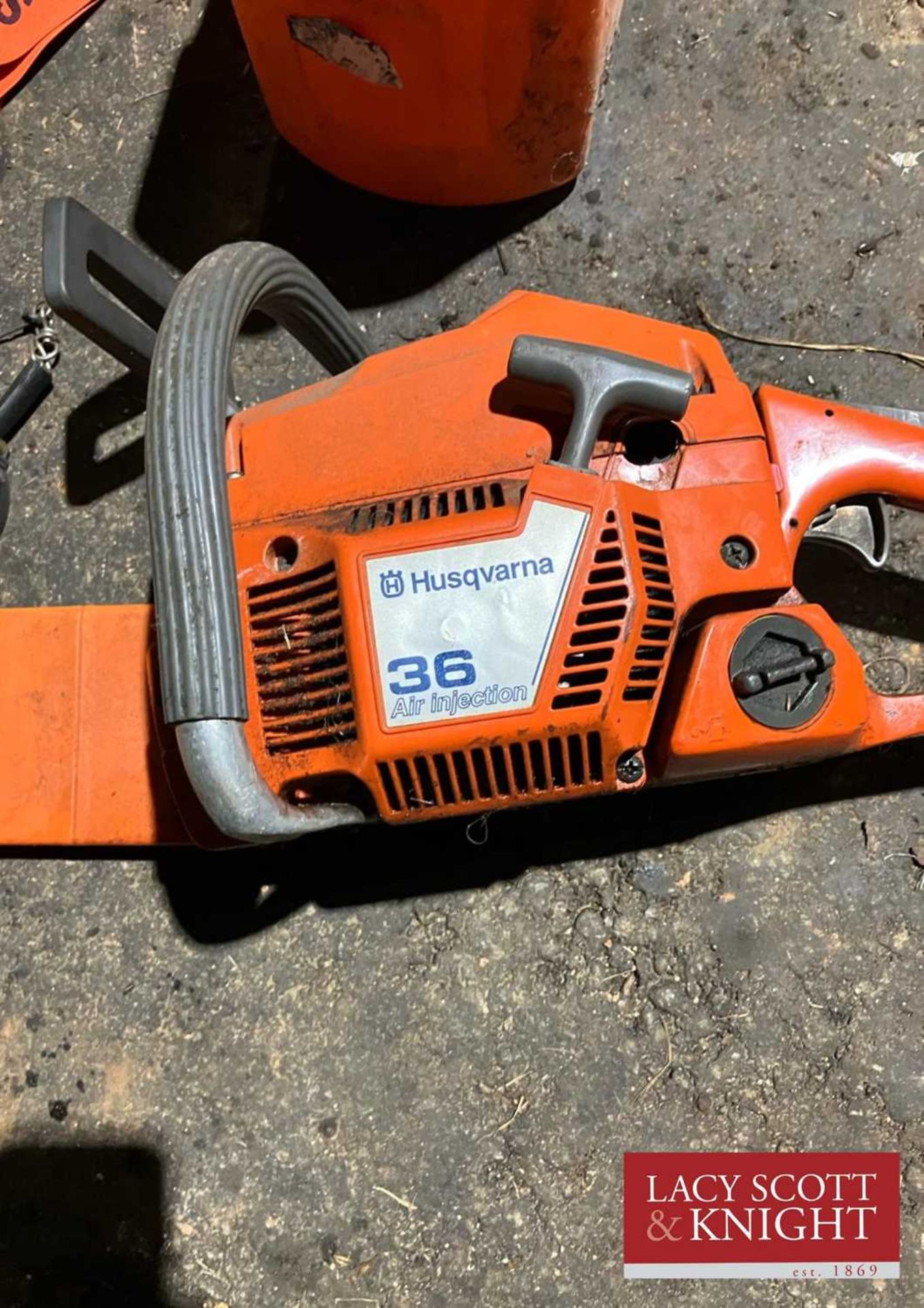 Husqvarna 36 Chainsaw plus tape, braces, mallet, gloves and log pick up tool (Located in Brandon) (