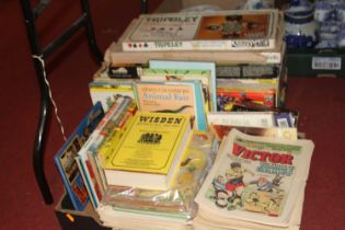 Two boxes of vintage comics, annuals and board games To include; Victor, Wisden, Beano, Topper,