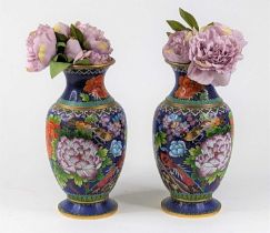 *A pair of Chinese cloisonne enamel vases each decorated with birds amongst chrysanthemums on a blue