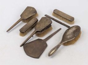 An Art Deco silver clad dressing table brush set, Birmingham 1936; together with an associated