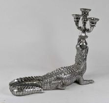 A silver painted three-branch table candelabra in the form of a crocodile, height 43cm