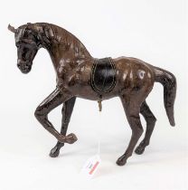 *A leather clad model of a standing horse, height 27cm