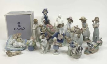A collection of sixteen Lladro, Nao and Royal Doulton porcelain figures, largest height 26cm Girl
