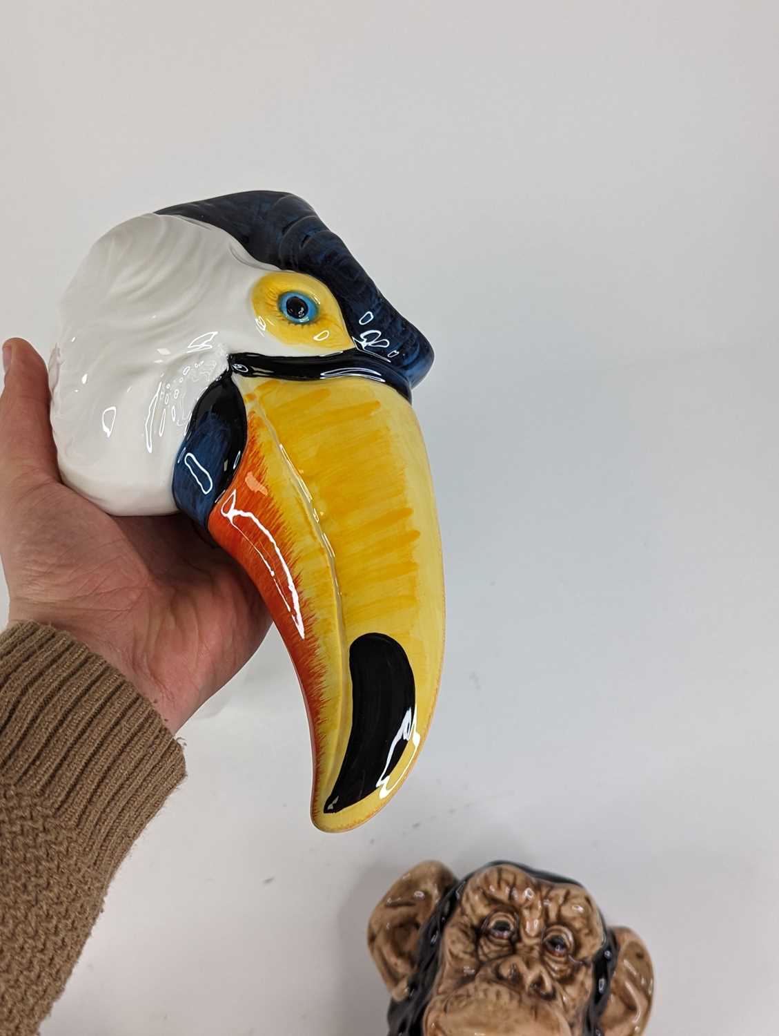 A pair of novelty wall pockets in the form of toucans, height 13cm, together with another pair in - Image 3 of 3