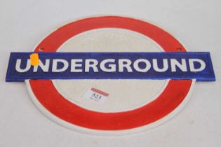 A reproduction London Underground cast iron wall sign, w.30cm