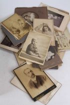 A collection of vintage photographs, mainly portraits