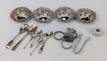 A set of four Victorian silver bonbon dishes, each repousse decorated with masks, swags and bows,
