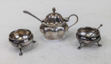 A Victorian silver mustard, of shaped oval form, having hinged lid and blue glass liner; together