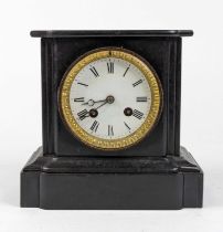 A Victorian black slate cased mantel clock, the enamel dial with Roman numeral markers and twin