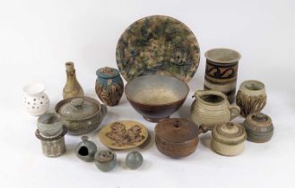 A collection of 20th century studio pottery to include a mottled glazed charger, incise decorated