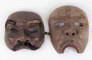 Two Japanese carved wooden Noh masks, largest 18cm high