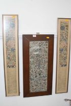 A Chinese embroidered panel, depicting figures within a garden, 54x19cm, housed within an oak frame,