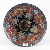 A Chinese cloisonne enamel charger, the centre decorated with a dragon surrounded by