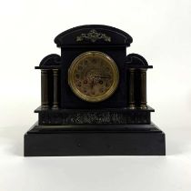 A Victorian black slate mantel clock, of architectural form,the brass dial showing Arabic