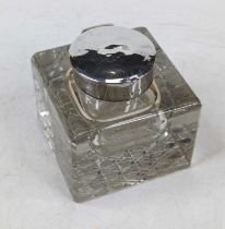 An Edwardian silver mounted cut glass inkwell, later engraved 'To Stafford Ransom from the staff