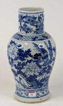 A Chinese porcelain vase of baluster shape, underglaze decorated with bird amongst flowers, height