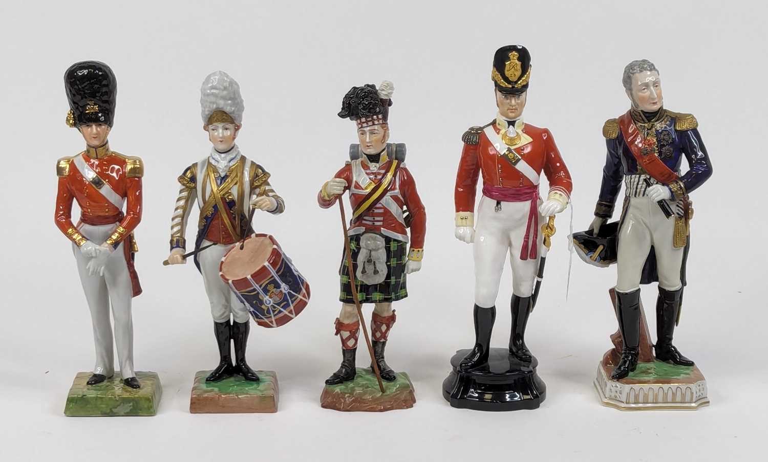 A collection of five porcelain figures of soldiers, to include Royal Worcester and Dresden examples,