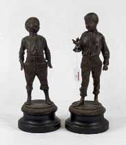 *After Ernest Rancoulet a pair of spelter figures of boys, each shown standing, mounted to further