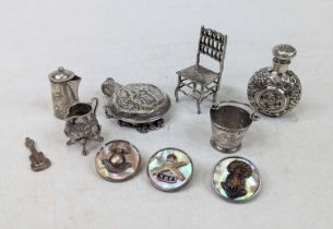 A collection of white metal items, to include miniature bucket, repousse decorated scent bottle,