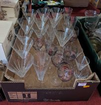 A set of eleven wine glasses, each having a cut funnel shaped bowl and circular foot, h.22cm;