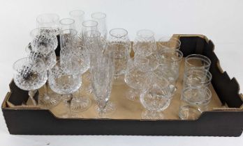 A set of six cut glass wine hocks, together with a set of eight cut glass champagne flutes,