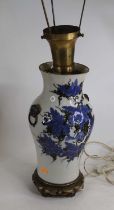 A Chinese blue & black glazed porcelain table lamp, of baluster form, flanked by twin dog mask