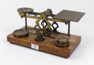 A pair of Victorian brass postal scales, bearing the name S Morden & Co, London, with a set of