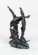 A verdigris metal figure group of two dolphins, shown on a naturalistic base, height 19cm