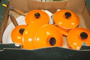 A collection of Le Creuset orange enamel cookware Signs of heavy use, staining to all enamel.Pan