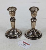 A pair of silver dwarf table candlesticks, on weighted bases, h.11cm