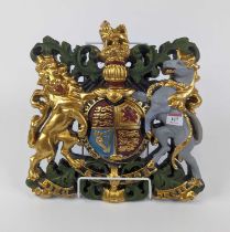A reproduction painted resin Royal Coat of Arms, 36x35cm