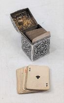 An Edwardian silver miniature playing card case, the domed hinged lid with vacant cartouche, the