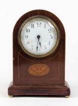 An Edwardian walnut and boxwood strung dome top mantel clock, the enamel dial with Arabic markers,