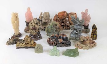 *A collection of oriental hardstone carvings, to include a soapstone example of a crane before a